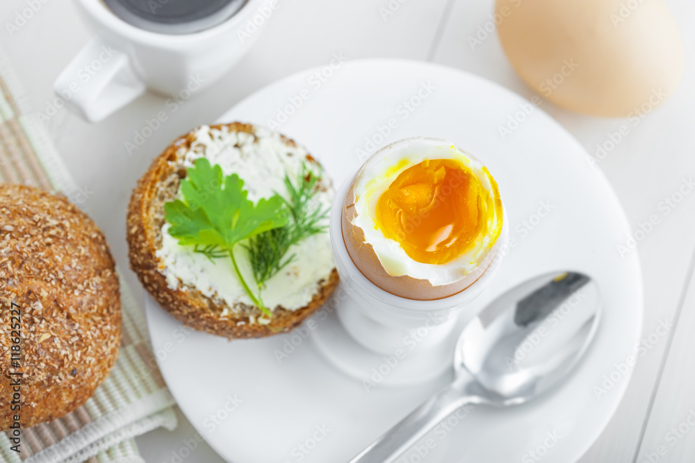 Healthy breakfast with perfect soft boiled egg, bread and butter, coffee cup. Delicious homemade food. Healthy breakfast with perfect soft boiled egg, bread and butter, coffee cup. Delicious homemade food.