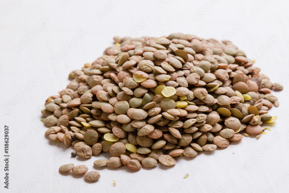 Fototapeta premium lentils on white table