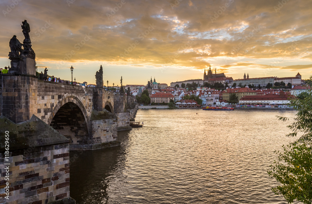 Shining Prague castle and Charles bridge in the early evening, Czech Republic, Europe