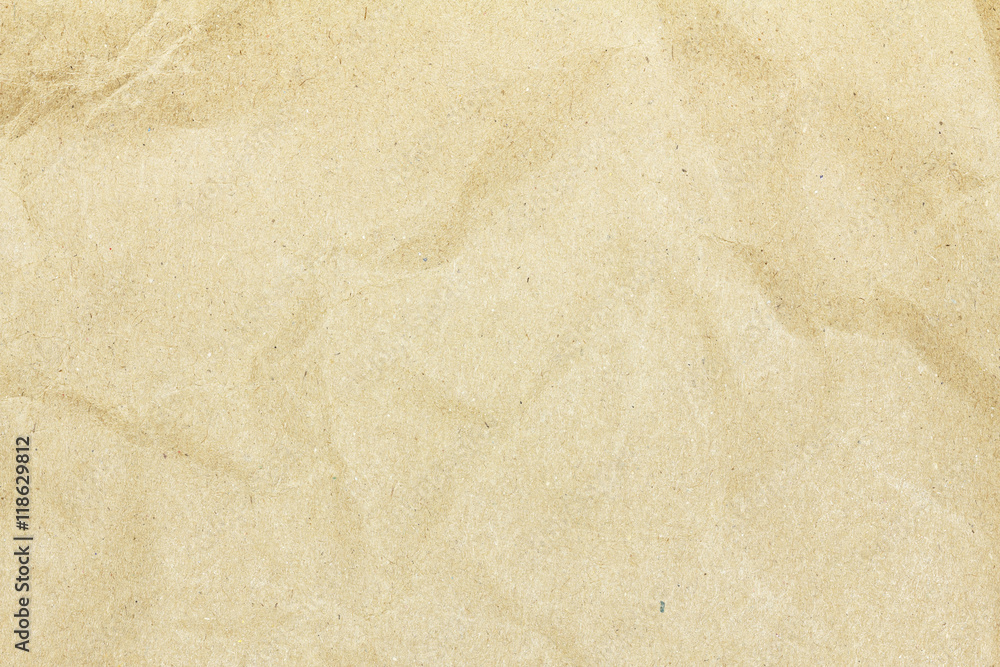 Fototapeta premium Recycled crumpled brown paper texture or paper background for design with copy space for text or image.