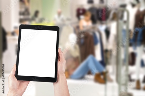 business and modern lifestyle concept: young woman shopping online, blank screen