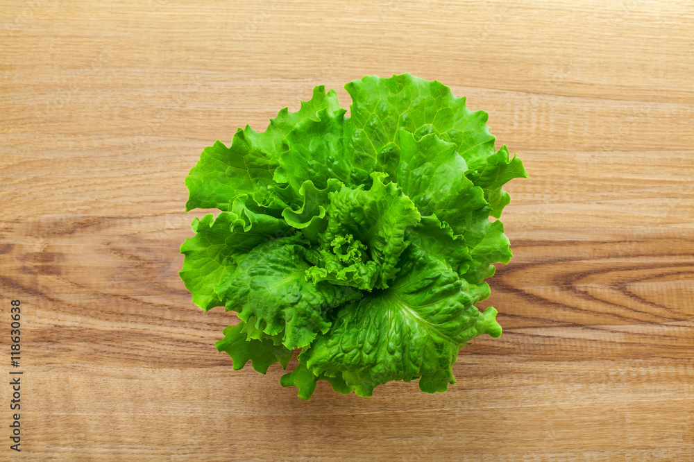 Fresh lettuce. Healthy vegetarian food on a table. Abstract concept. Top view, close-up. Fresh lettuce. Healthy vegetarian food on a table. Abstract concept. Top view, close-up.