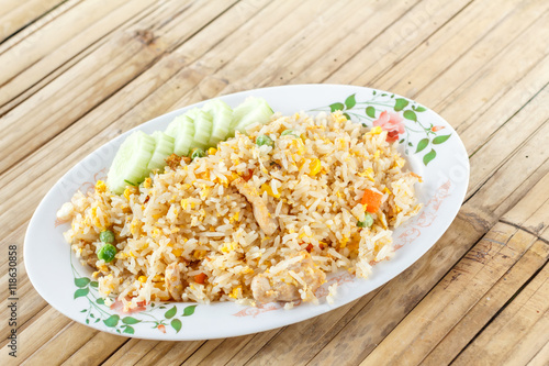 Fried rice with pork on wood background. Fried rice Thai style. Asian style food.