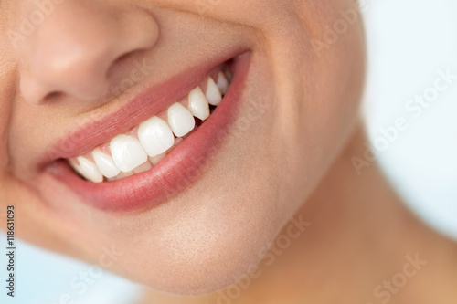 Fototapeta Naklejka Na Ścianę i Meble -  Closeup Of Beautiful Smile With White Teeth. Woman Mouth Smiling. High Resolution Image
