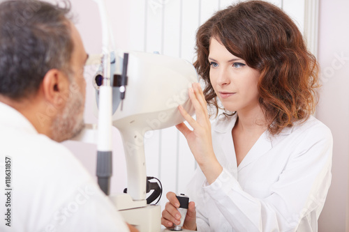 young female optometrist working in lab