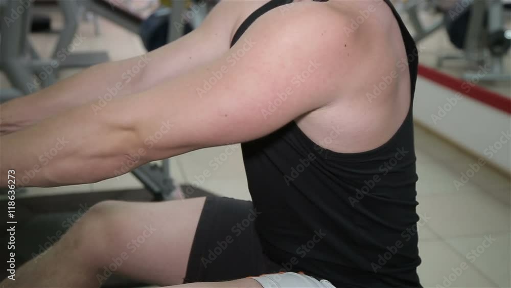 Close-up of a man performs gym exercises Close-up of a man performs gym exercises