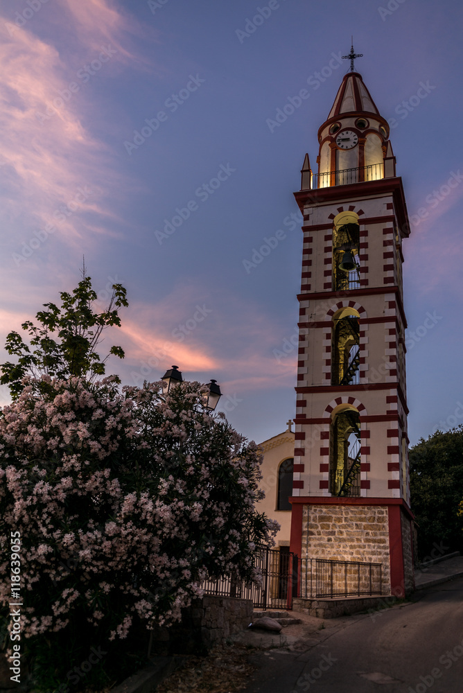 Sunset on a church in a village in the mountains of Corsica