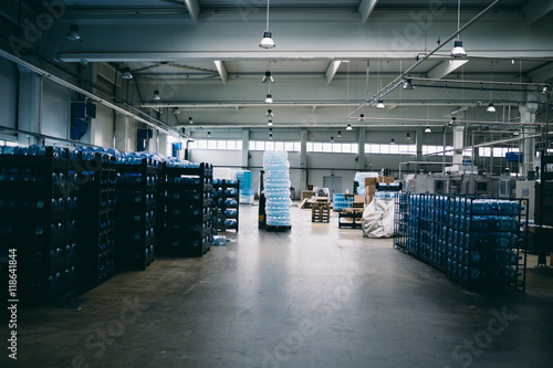 Industry interior. Warehouse of factory for purification and bottling of drinking water into bottles and canisters.