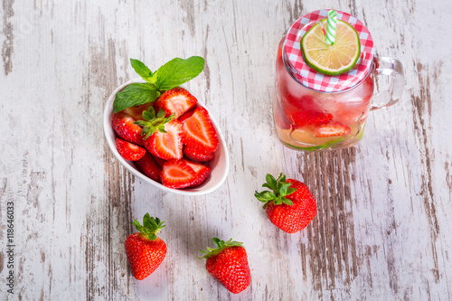 Summer strawberry lemonade in a jar glass
