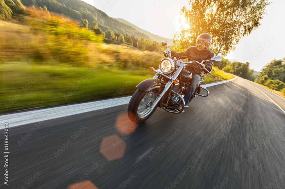 Fototapeta Motorcycle driver riding on motorway