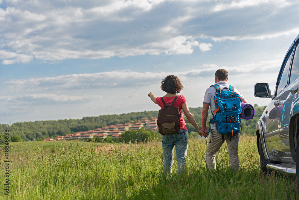 Young couple hiking on mountain Young couple hiking on mountain