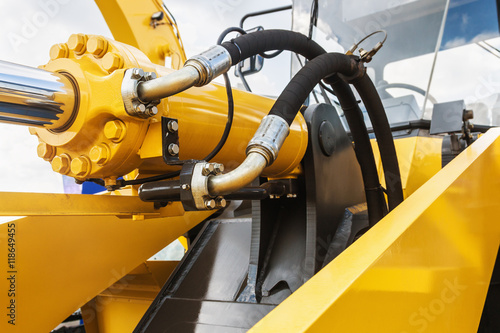hydraulics tractor yellow photo