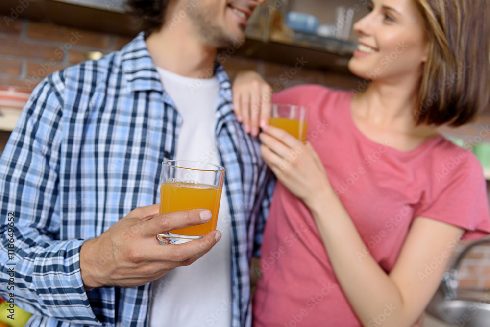 Happy family enjoying healthy drink at home Happy family enjoying healthy drink at home
