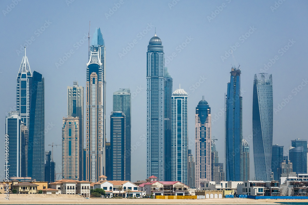 Fototapeta premium Modern skyscrapers in Dubai city from Palm Jumeirah Island. UAE