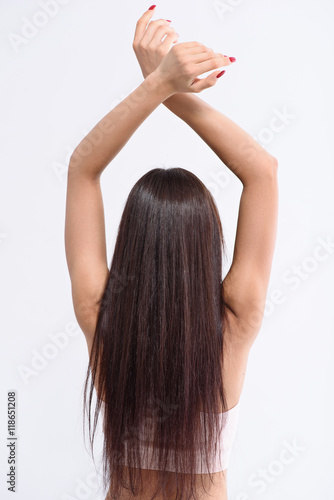 Cheerful girl stretching hands up