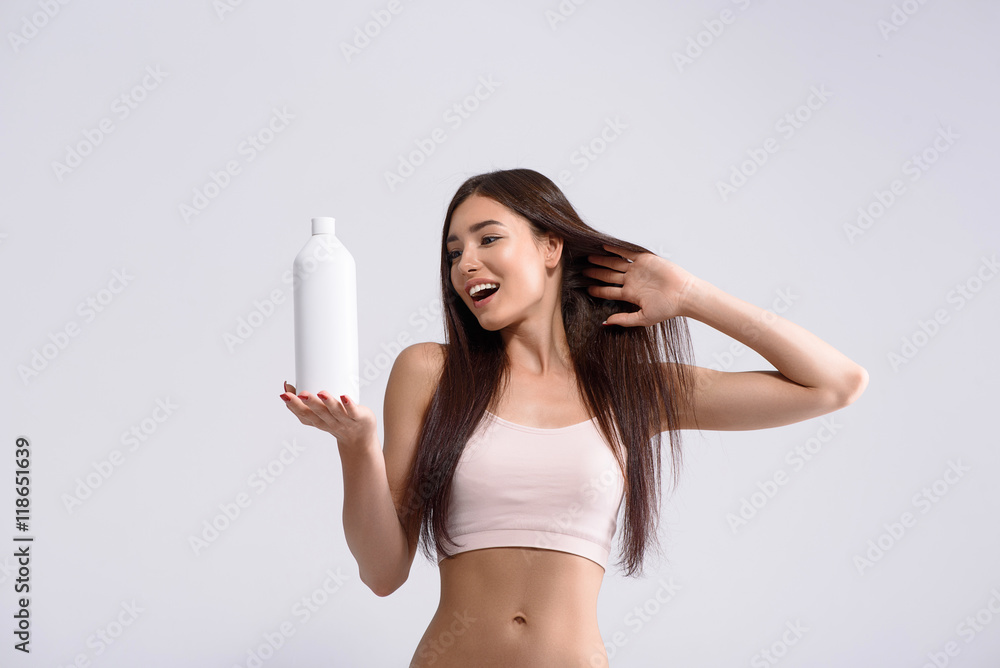 Happy girl is satisfied with washing product Happy girl is satisfied with washing product