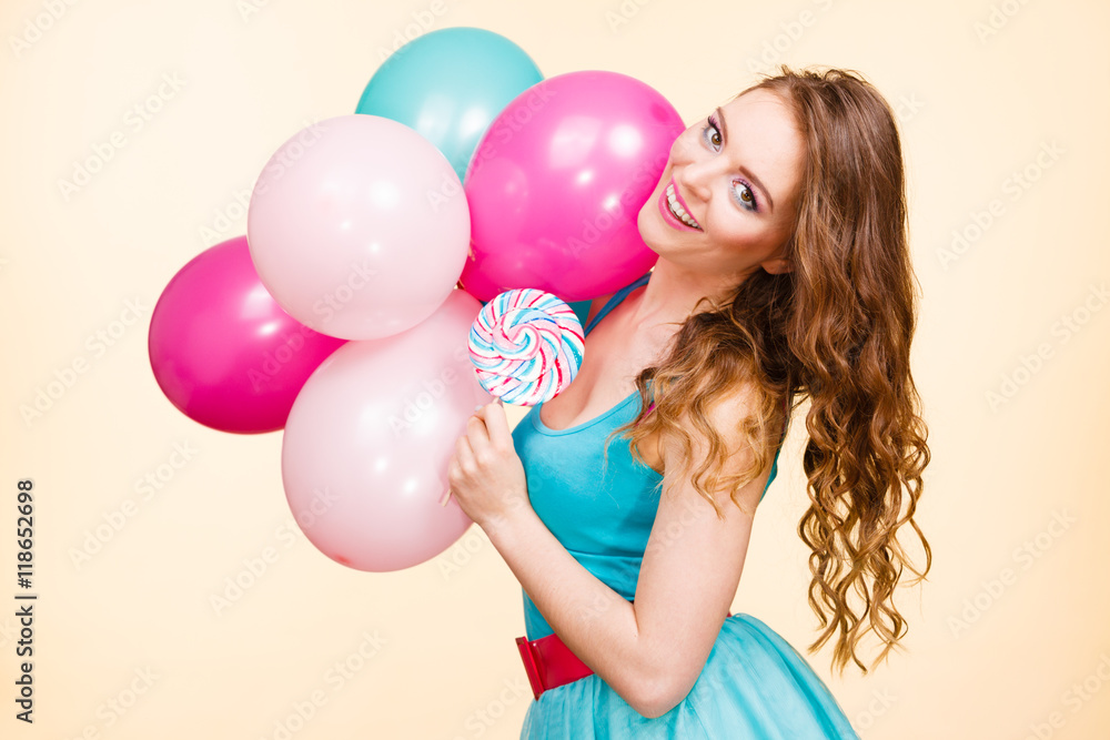 Woman with colorful balloons and lollipop Woman with colorful balloons and lollipop