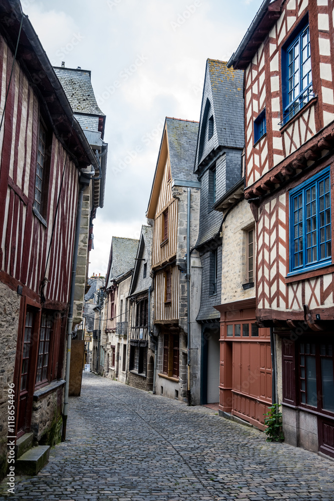 Narrow street with medieval half timbered houses from Brittany, France