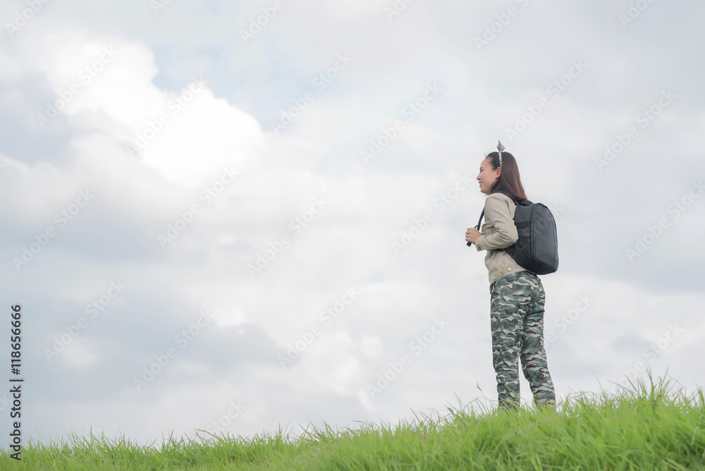 Carefree woman having a good time at the meadow