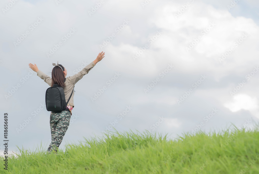 Carefree woman having a good time at the meadow Carefree woman having a good time at the meadow