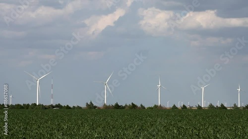 Kansas / Oklahoma - Landscape 01 Medium-wide shot of corn field with wind turbines on horizon, shot with long lens photo