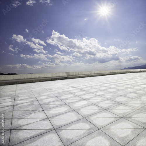 empty brick floor in sunny sky