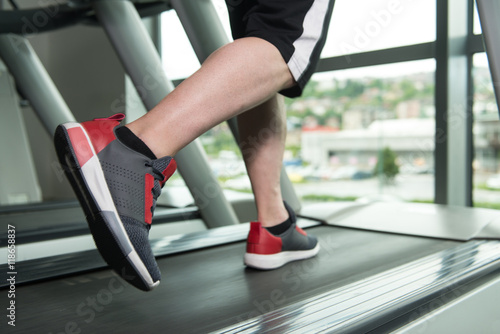 Close-Up Man Feet On Treadmill