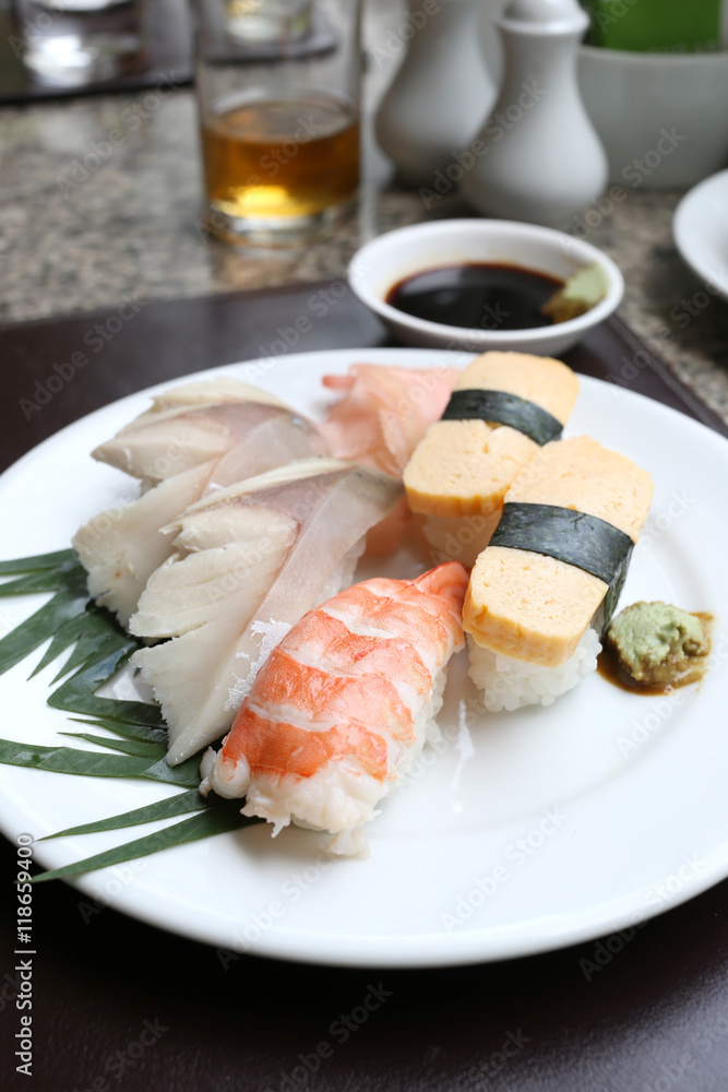 Seafoods Sushi on white dish in the restaurant. Seafoods Sushi on white dish in the restaurant.