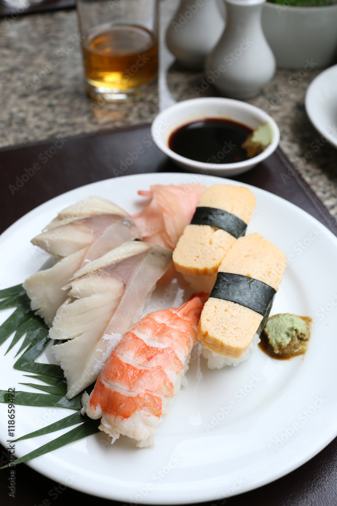 Seafoods Sushi on white dish in the restaurant. Seafoods Sushi on white dish in the restaurant.
