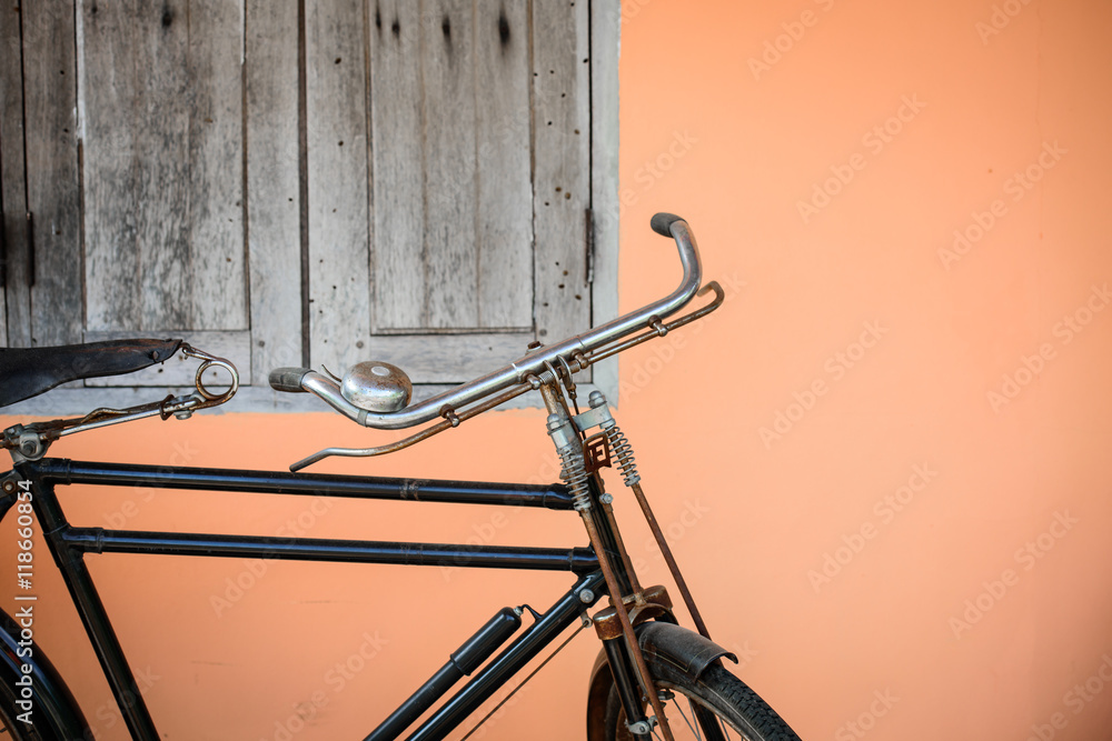 vintage bike with orange wall background