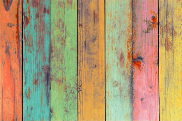 The colorful artwork painted on wood material for vintage wallpaper background.