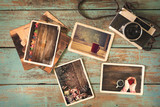 Merry christmas (xmas) photo album on old wood table. paper photo of polaroid camera - vintage and retro style