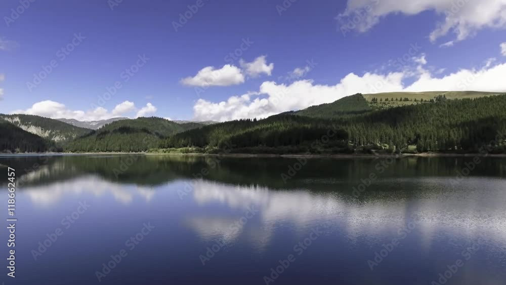 Fly Over Mirror Mountain Lake Surrounded By Forest
Fly Over Mirror Mountain Lake Surrounded By Forest