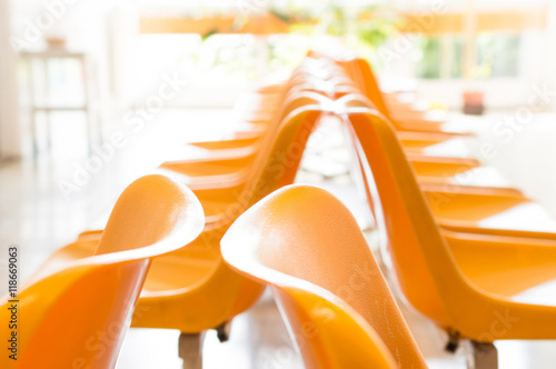 Doctor's waiting room with chairs and potted plant