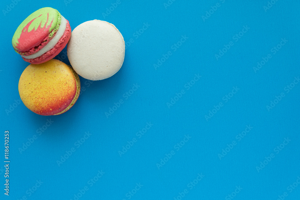 Colorful france macarons on blue background. Colorful france macarons on blue background.
