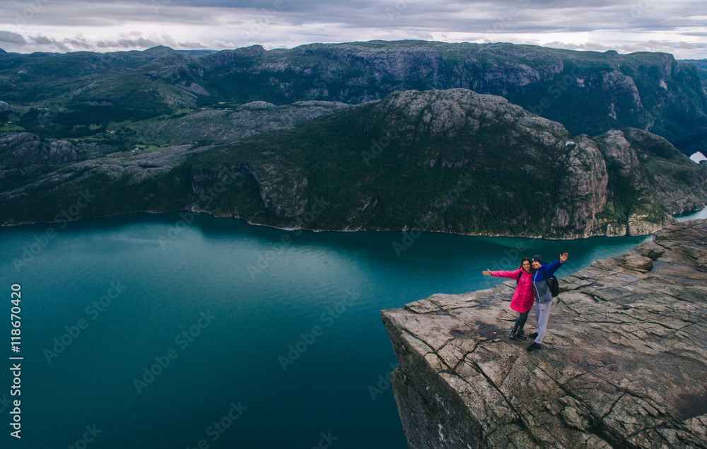couple in love Preikestolen massive cliff (Norway, Lysefjorden s