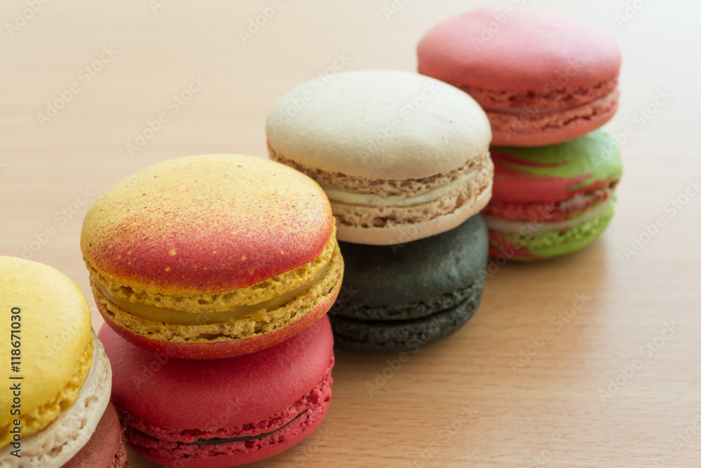 Colorful france macarons on wooden desk background. Colorful france macarons on wooden desk background.