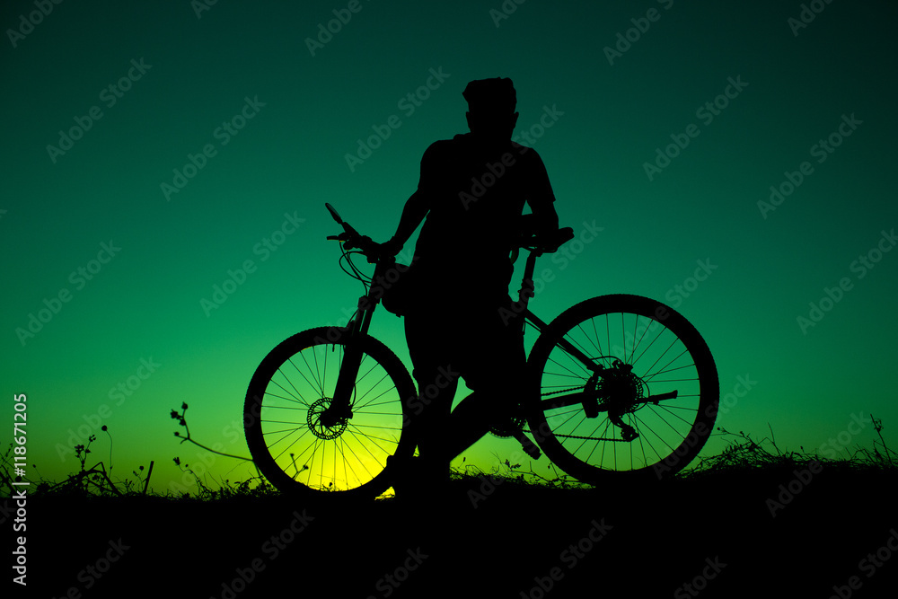 Obraz premium sunset and silhouette backlight bikers