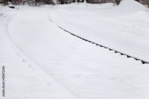 railroad tracks in the snow