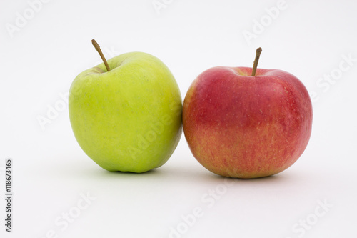 green and red apple on a white background