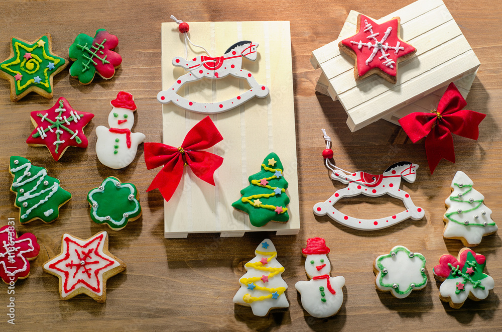 Christmas cookies with holidays decor on wooden background. Christmas cookies with holidays decor on wooden background.