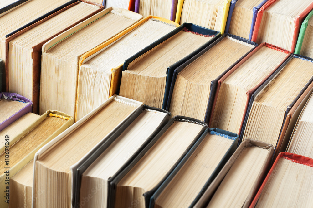 Obraz premium Stack of colorful books. Education background. Back to school. Copy space for text.