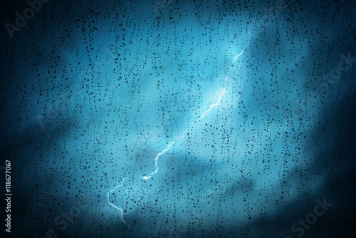 Фотография Raindrops on a window during bad, rainy weather.