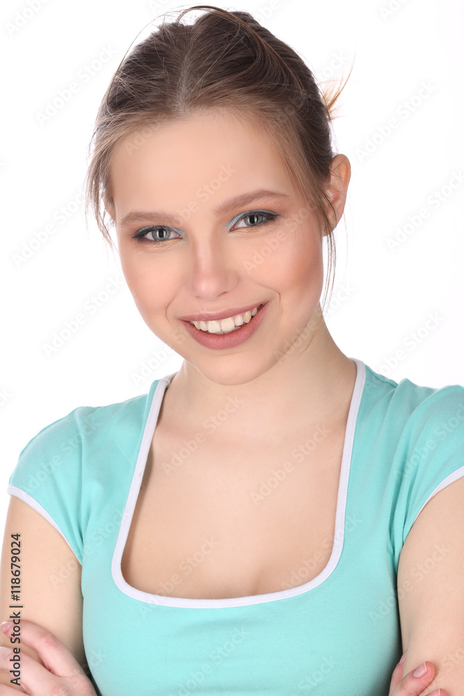 Smiling girl with makeup and crossed arms. Close up. White background