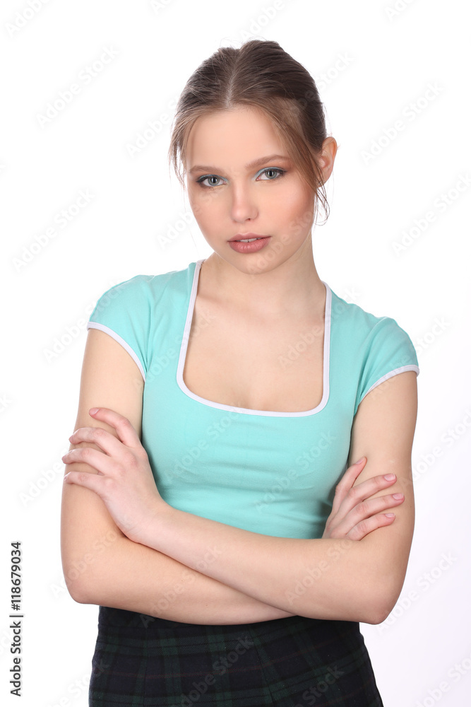 Girl with crossed arms posing. Close up. White background Girl with crossed arms posing. Close up. White background