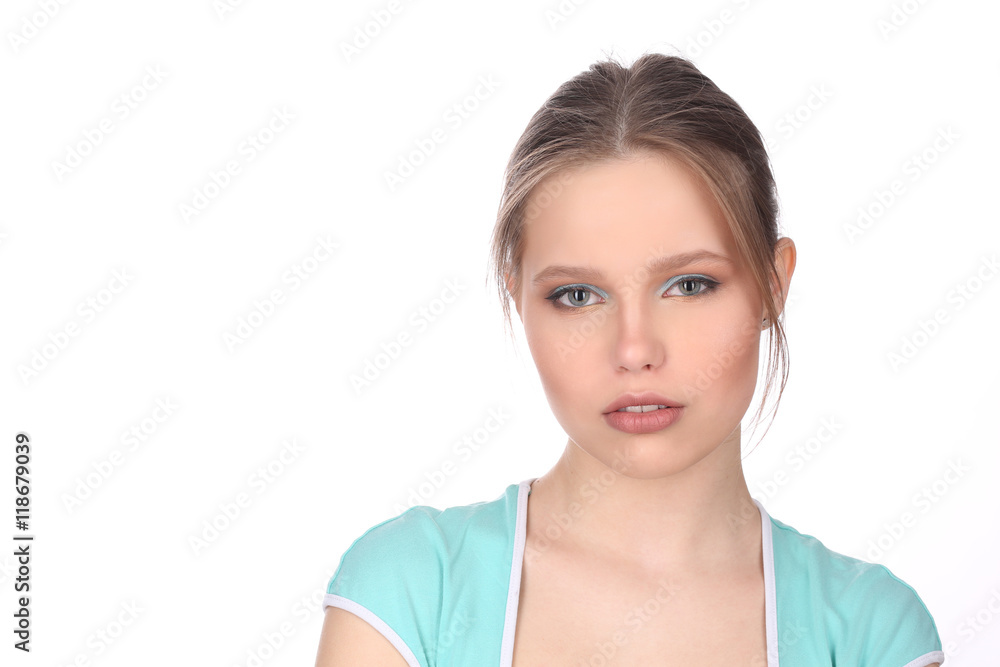 Model with makeup wearing blue T-shirt. Close up. White background Model with makeup wearing blue T-shirt. Close up. White background