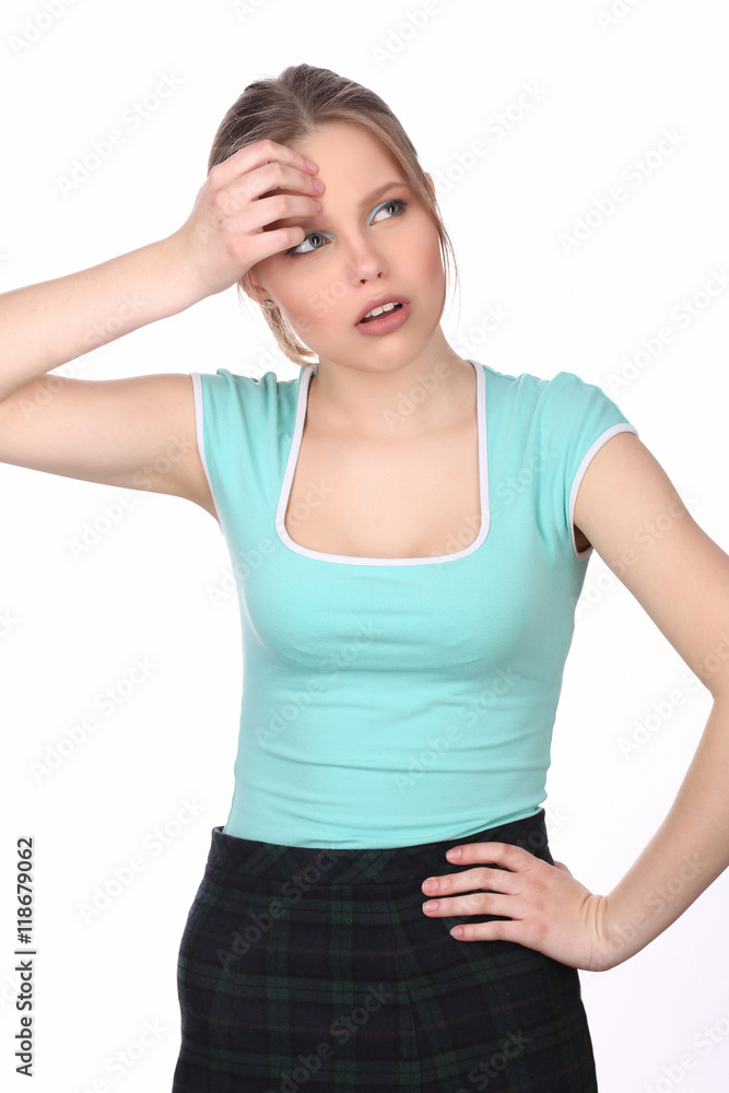 Girl touching her forehead and looking away. Close up. White background Girl touching her forehead and looking away. Close up. White background