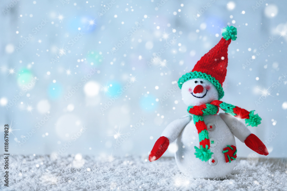 Cute snowman on Christmas background. Snow effect