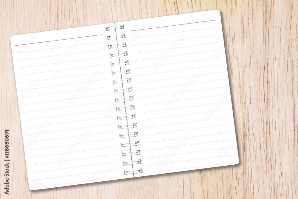 Open notebook paper with line on nature wood background for design with copy space for text or image. Open notebook paper with line on nature wood background for design with copy space for text or image.