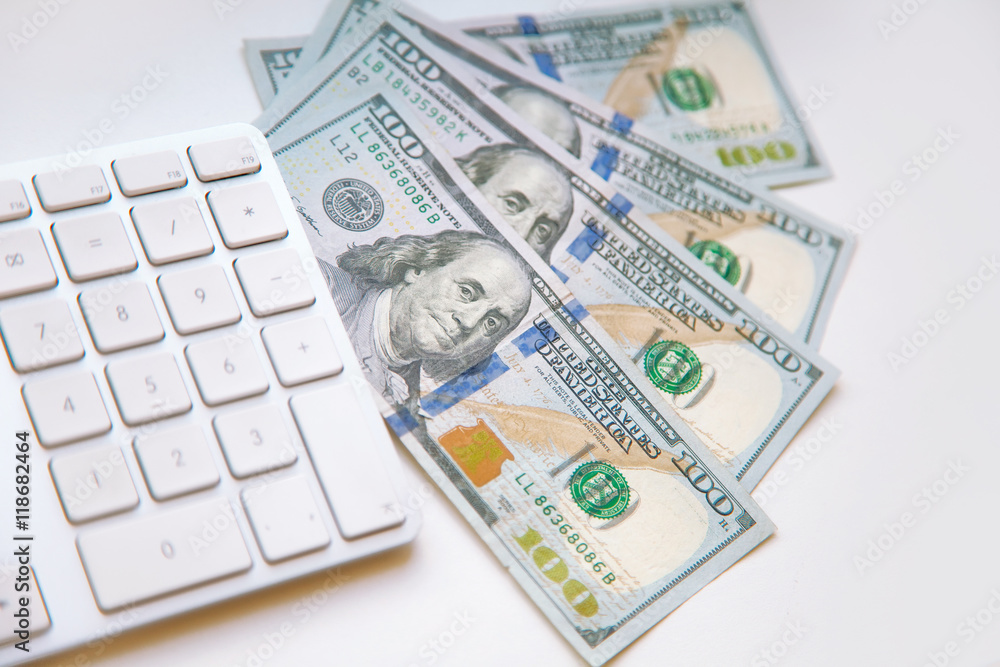 dollars bank notes and money coins. with computer keyboard. dollars bank notes and money coins. with computer keyboard.